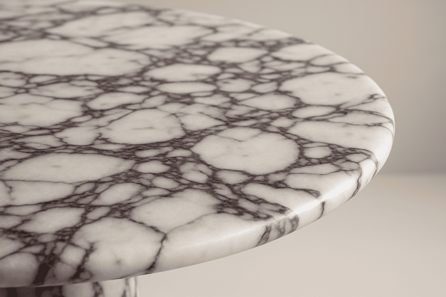 Close-up of a marble table with a white and gray pattern.