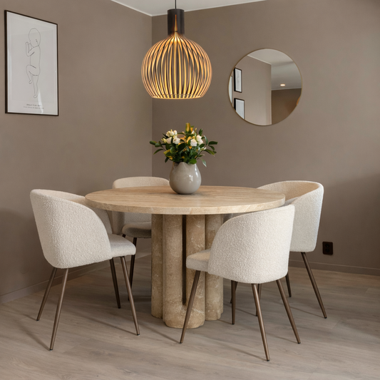 Dining room with a designer travertine table and chairs,