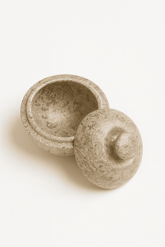 Stone pot with lid on a white background