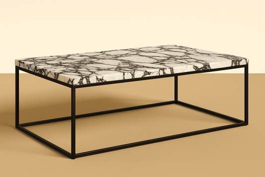 Coffee table with marble-like top and black metal frame on a beige background