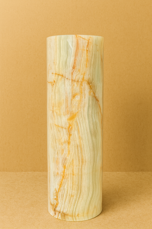 Cylindrical onyx marble  vase with marble pattern on a beige background