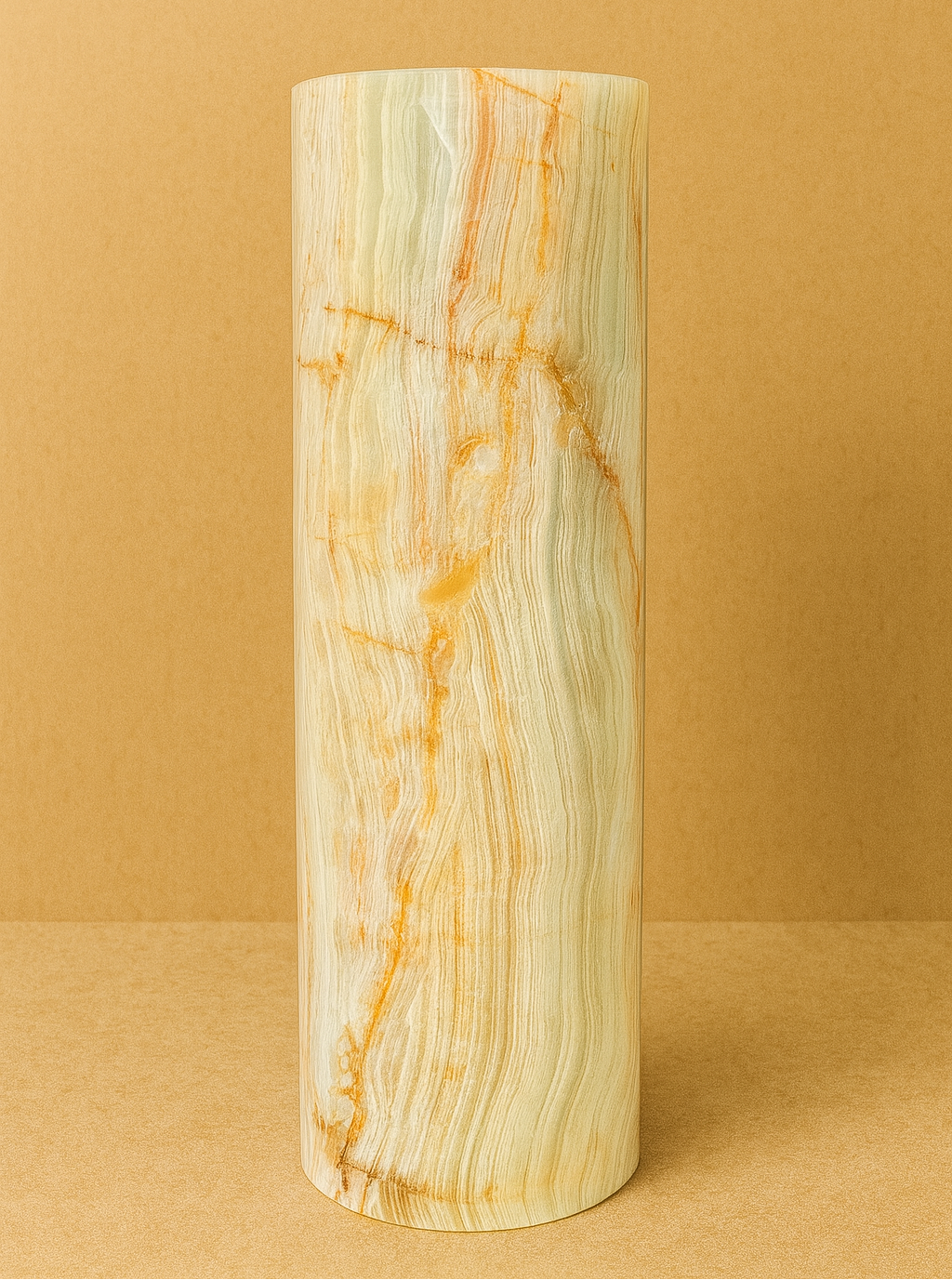 Cylindrical onyx marble vase with marble pattern on a beige background
