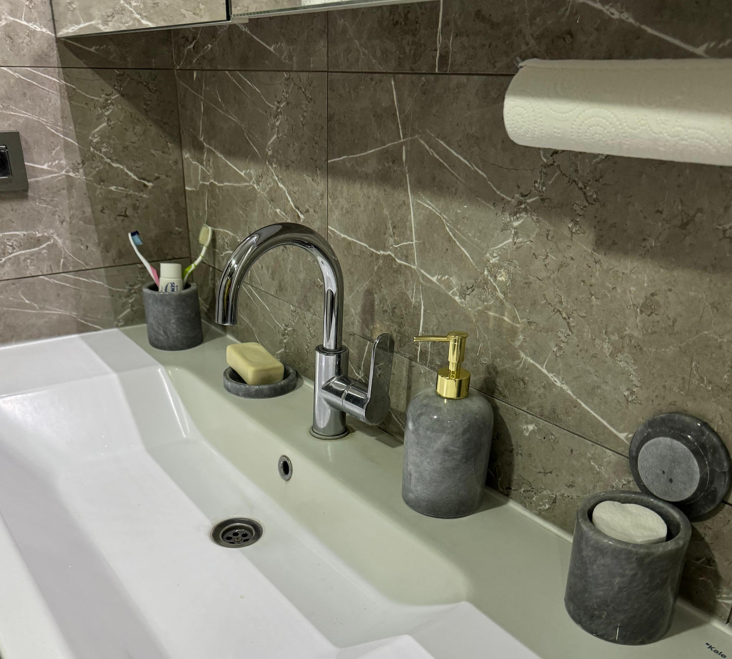 Sustainable 5-piece gray marble bathroom set with gold or silver pump. Includes dispenser, dish, tumblers, and tray. Handcrafted by Aurora Marble artisans.