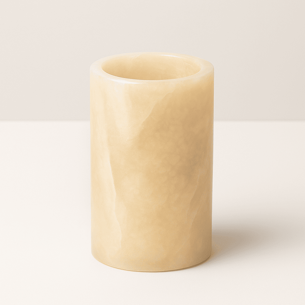 Beige cylindrical marble vase on a white background