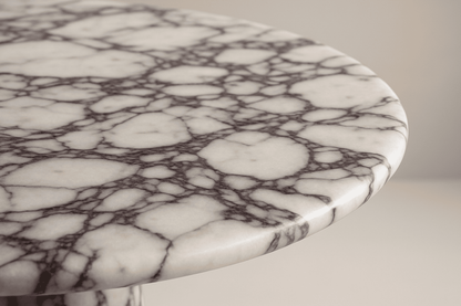 Close-up of a marble table with a white and gray pattern.