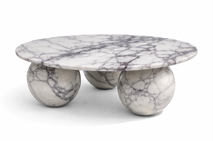Marble coffee table with spherical bases on a white background lilac marble