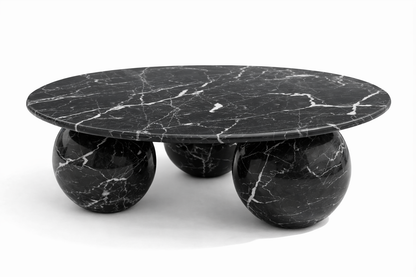 Black marble coffee table with spherical bases on a white background nero marquina black marble table
