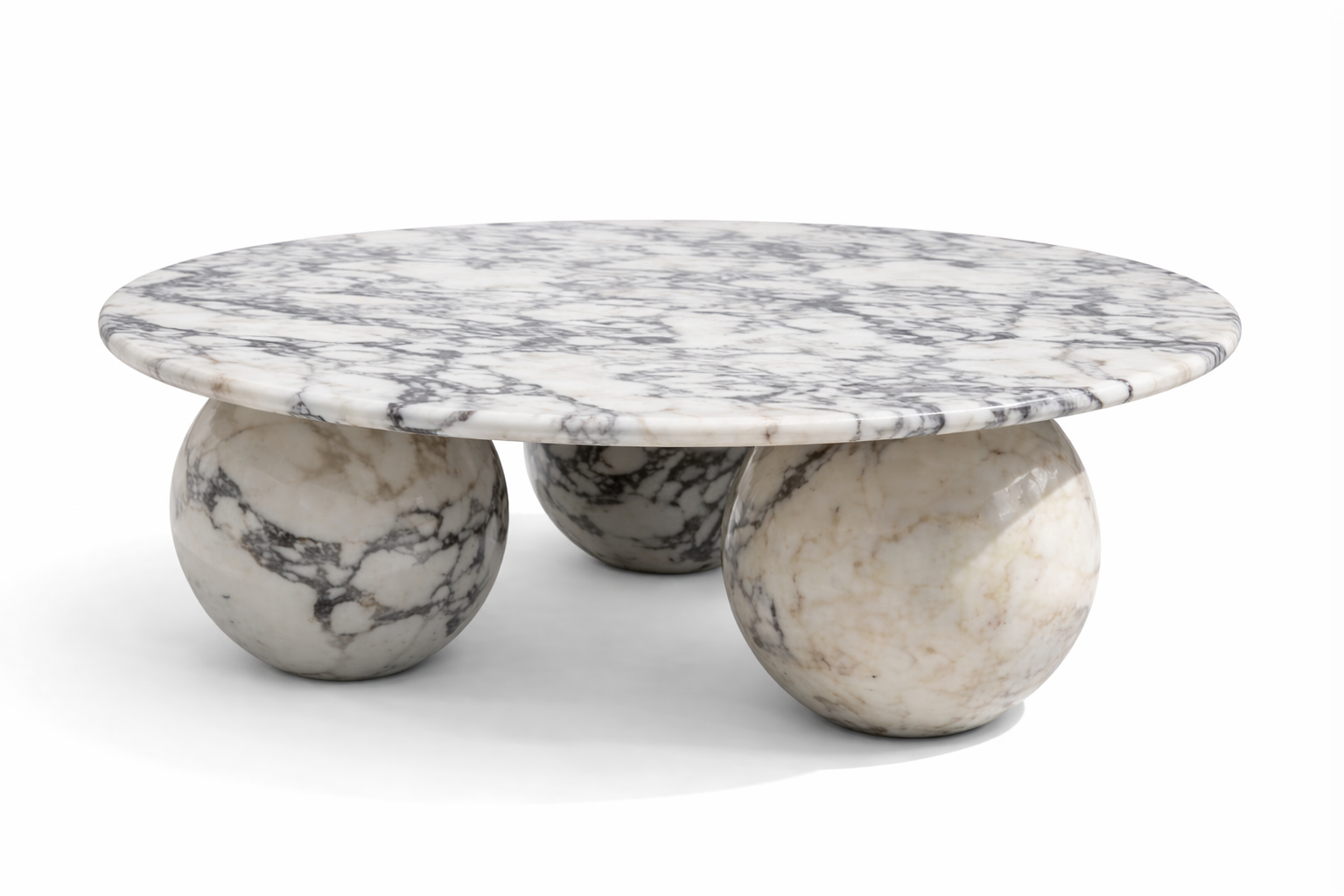 Marble coffee table with spherical bases on a white background calacatta viola
