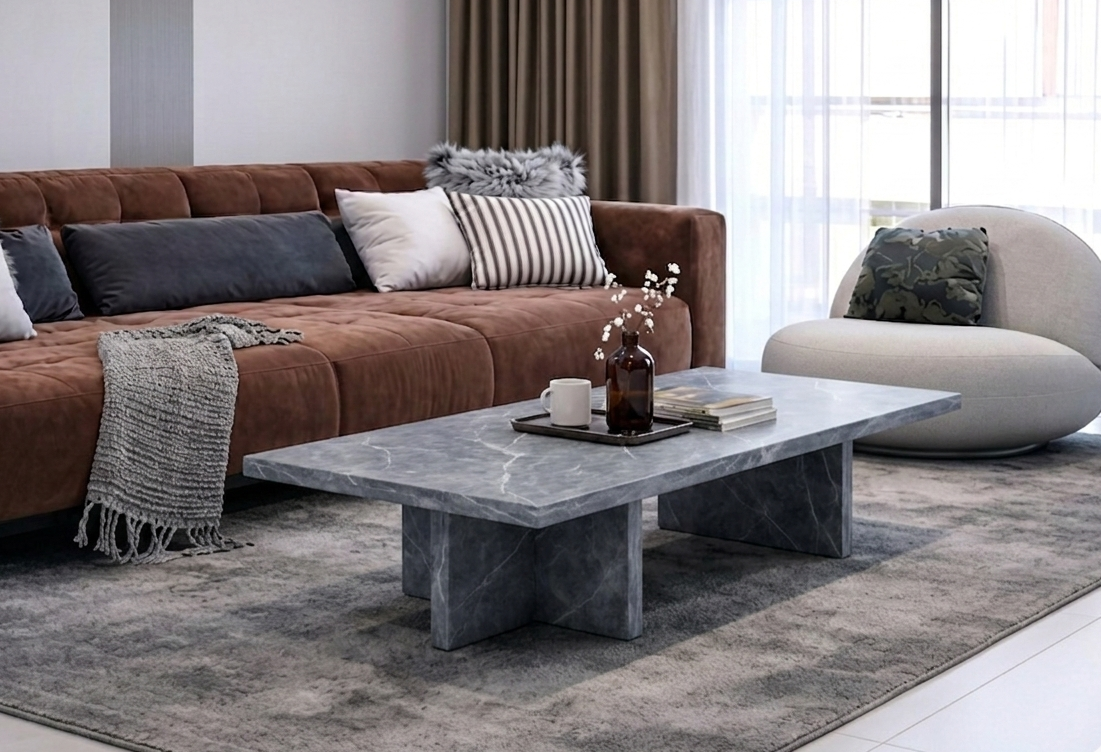Modern living room with a brown sectional sofa, gray coffee table, and decorative pillows.