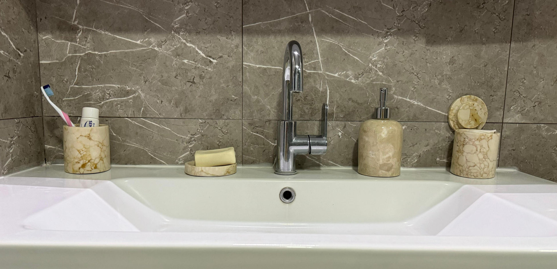 marble bathroom set, luxury bathroom accessories, handcrafted marble, bathroom décor, cream marble, Scandinavian design, stone soap dispenser, natural marble tray, high-end bathroom set, Aurora Marble