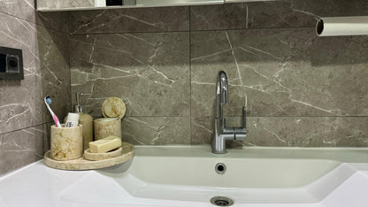 marble bathroom set, luxury bathroom accessories, handcrafted marble, bathroom décor, cream marble, Scandinavian design, stone soap dispenser, natural marble tray, high-end bathroom set, Aurora Marble