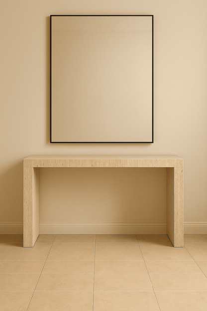 Beige wall with a rectangular mirror and a matching wooden console table.