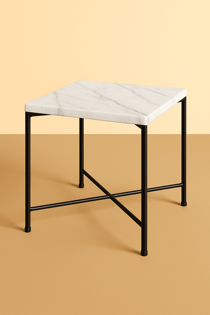 Small side table with marble top and black metal legs on a beige background