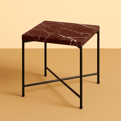 Small square table with marble top and black metal legs on a beige background