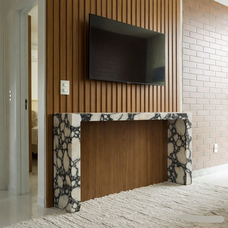 Modern living room with a marble console table and wall-mounted TV.