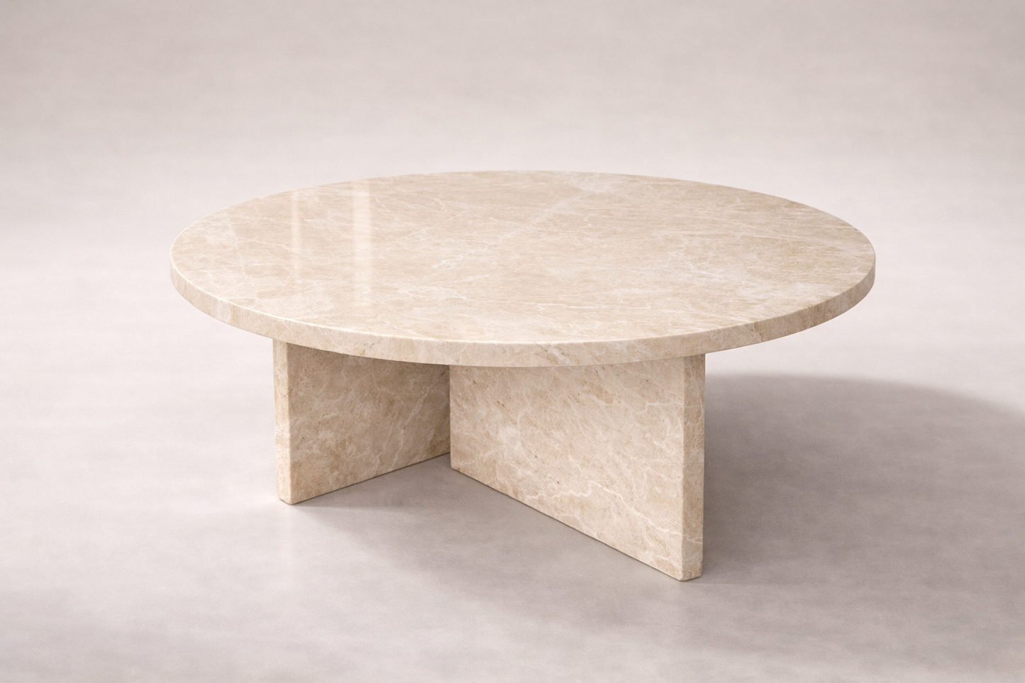 Round marble table on a plain background