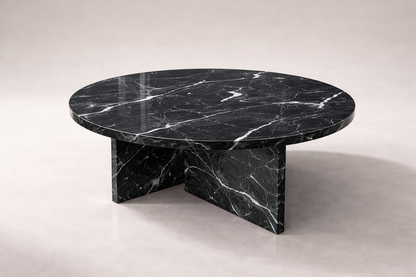 Black marble coffee table on a light gray background