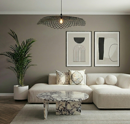 Modern living room with a beige sectional sofa, marble coffee table, and abstract art on the wall.