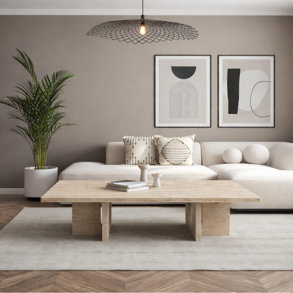 Modern living room with a beige sofa, beige marble coffee table, and abstract art on the wall.