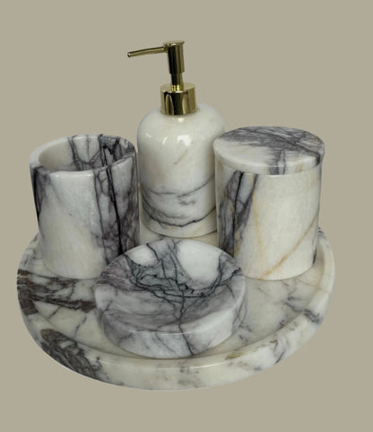 Sustainable 5-piece calacatta viola marble bathroom set with gold or silver pump. Includes dispenser, dish, tumblers, and tray. Handcrafted by Aurora Marble artisans.
