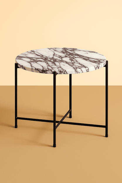 round side table with marble top and black metal frame on a beige background from aurora marble