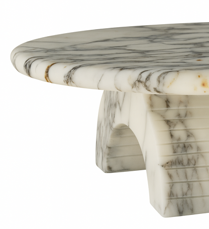 Marble table with a white and gray veined pattern on a white background
