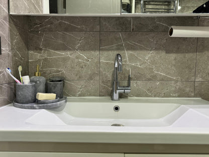Sustainable 5-piece gray marble bathroom set with gold or silver pump. Includes dispenser, dish, tumblers, and tray. Handcrafted by Aurora Marble artisans.