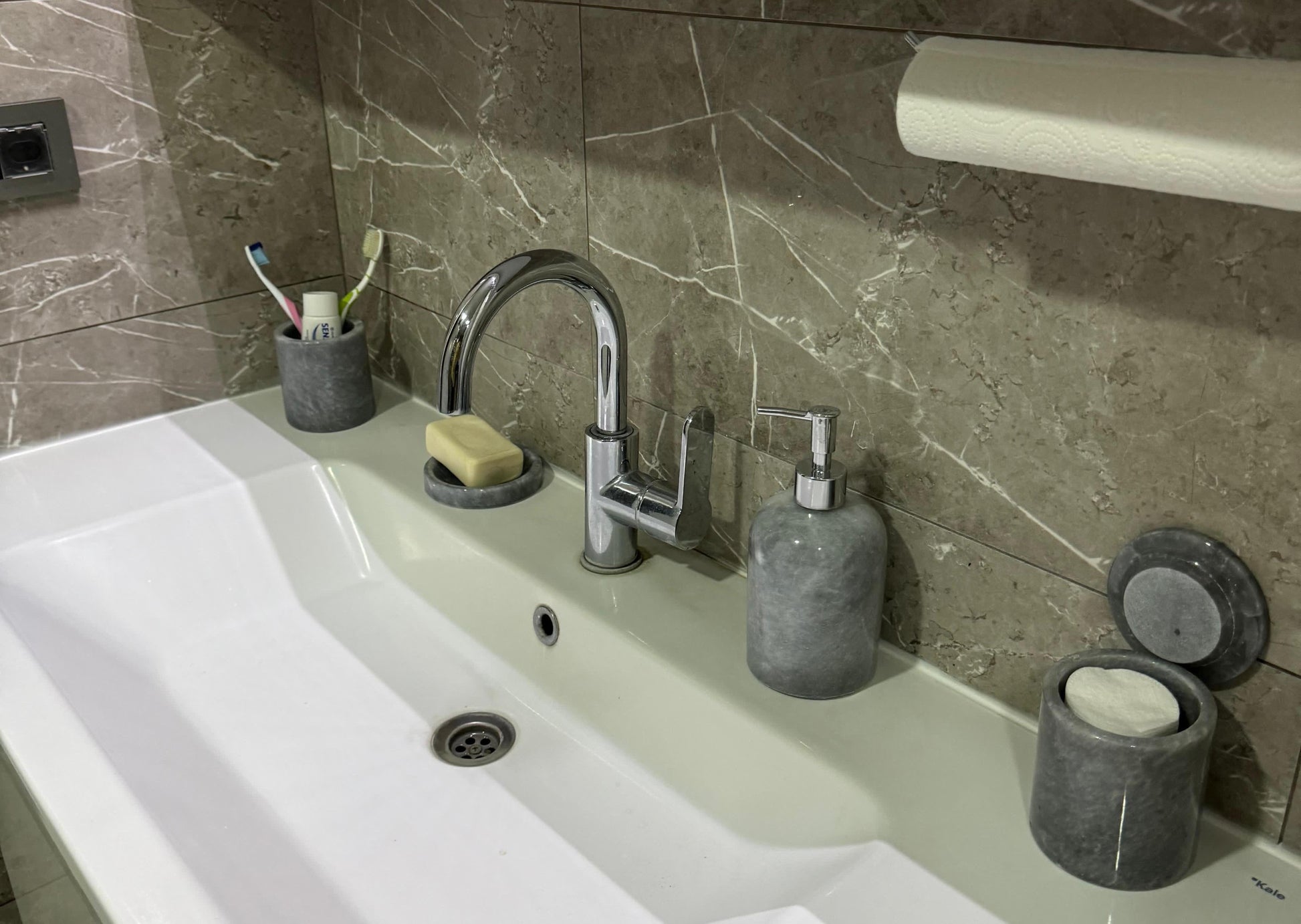 Sustainable 5-piece gray marble bathroom set with gold or silver pump. Includes dispenser, dish, tumblers, and tray. Handcrafted by Aurora Marble artisans.