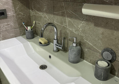 Sustainable 5-piece gray marble bathroom set with gold or silver pump. Includes dispenser, dish, tumblers, and tray. Handcrafted by Aurora Marble artisans.