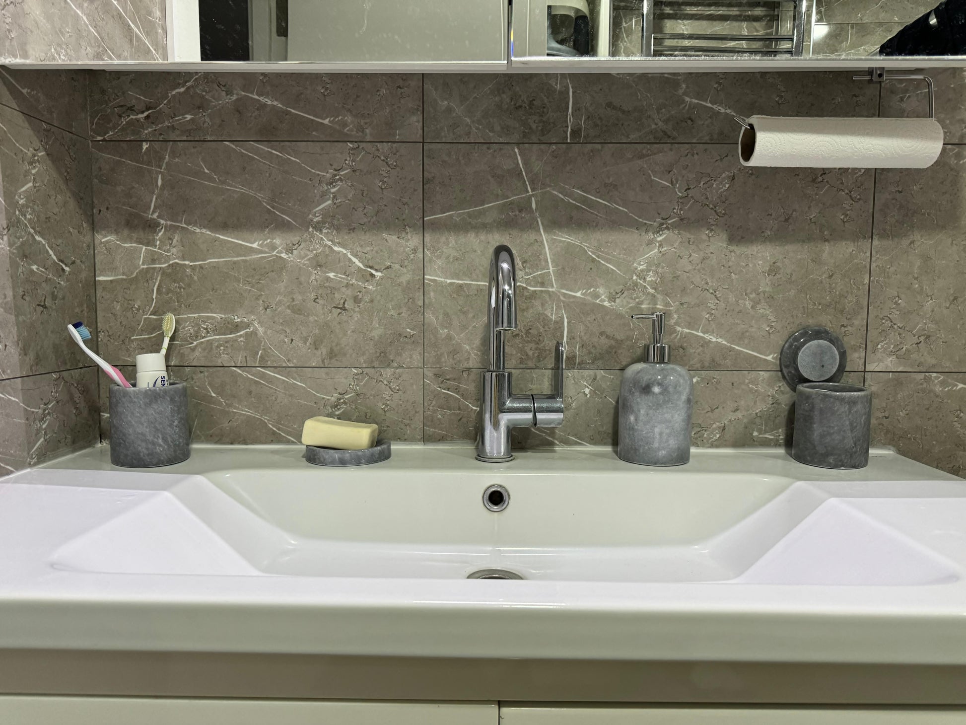 Sustainable 5-piece gray marble bathroom set with gold or silver pump. Includes dispenser, dish, tumblers, and tray. Handcrafted by Aurora Marble artisans.
