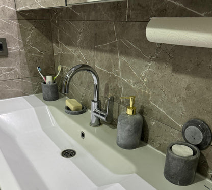 Sustainable 5-piece gray marble bathroom set with gold or silver pump. Includes dispenser, dish, tumblers, and tray. Handcrafted by Aurora Marble artisans.