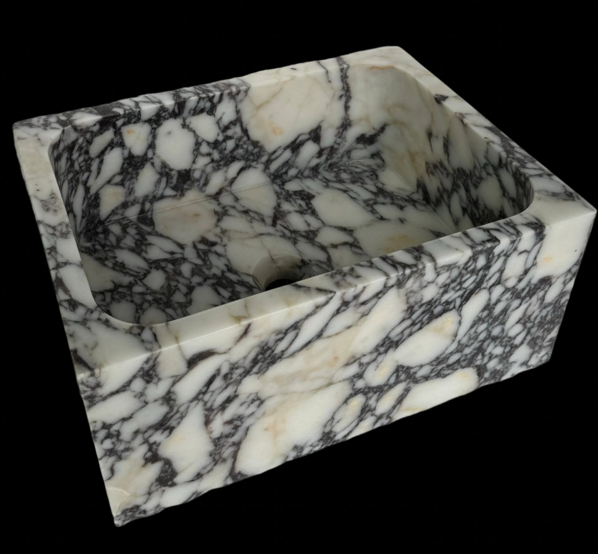 Luxury Calacatta Viola marble sink by Aurora Marble, featuring bold burgundy veining and minimalist sculptural design, handcrafted for high-end bathroom interiors.