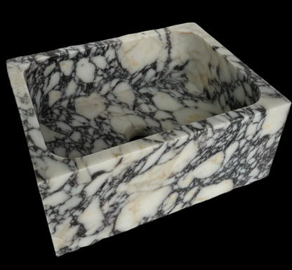 Luxury Calacatta Viola marble sink by Aurora Marble, featuring bold burgundy veining and minimalist sculptural design, handcrafted for high-end bathroom interiors.