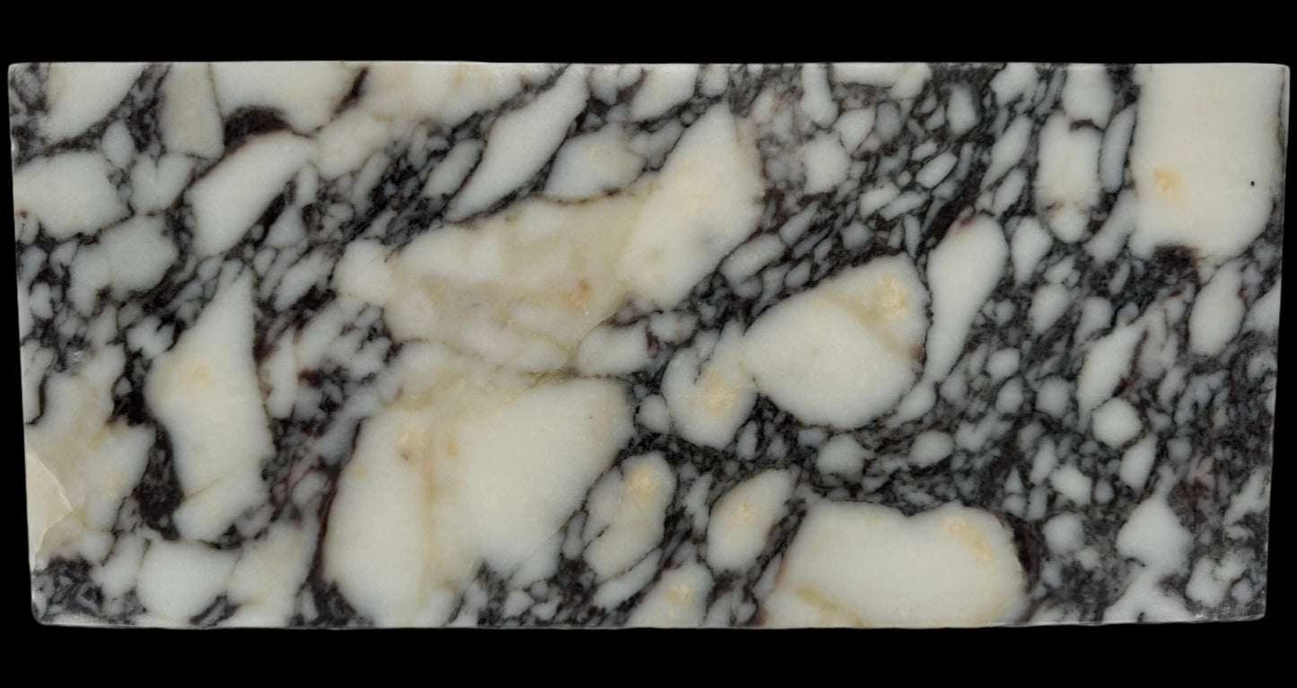 Luxury Calacatta Viola marble sink by Aurora Marble, featuring bold burgundy veining and minimalist sculptural design, handcrafted for high-end bathroom interiors.