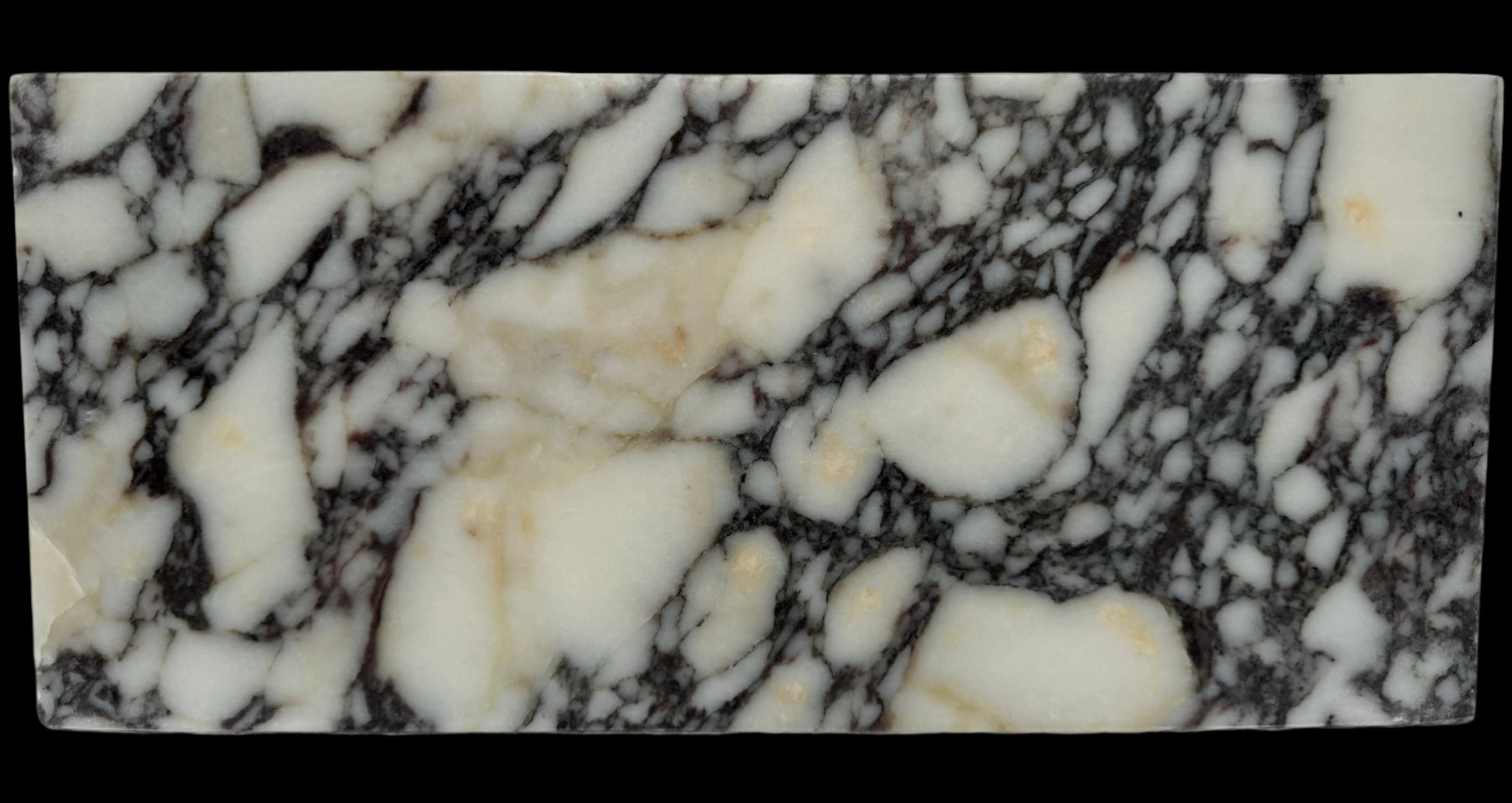 Luxury Calacatta Viola marble sink by Aurora Marble, featuring bold burgundy veining and minimalist sculptural design, handcrafted for high-end bathroom interiors.