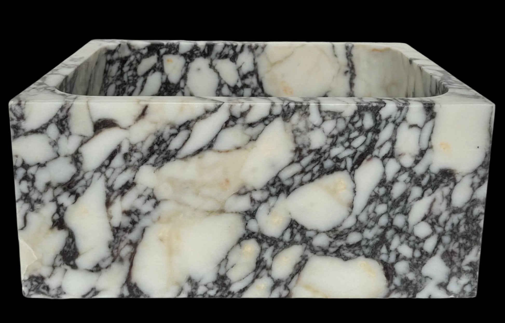 Luxury Calacatta Viola marble sink by Aurora Marble, featuring bold burgundy veining and minimalist sculptural design, handcrafted for high-end bathroom interiors.
