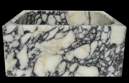Luxury Calacatta Viola marble sink by Aurora Marble, featuring bold burgundy veining and minimalist sculptural design, handcrafted for high-end bathroom interiors.