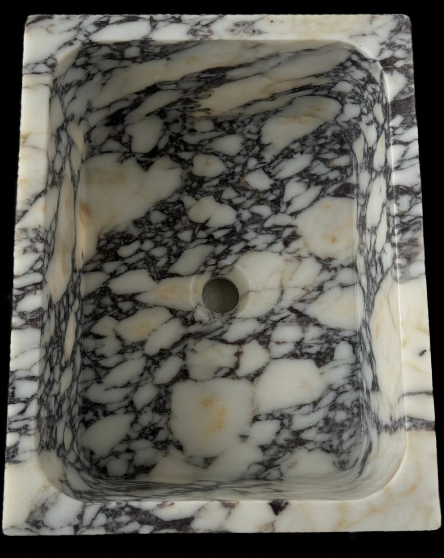 Luxury Calacatta Viola marble sink by Aurora Marble, featuring bold burgundy veining and minimalist sculptural design, handcrafted for high-end bathroom interiors.