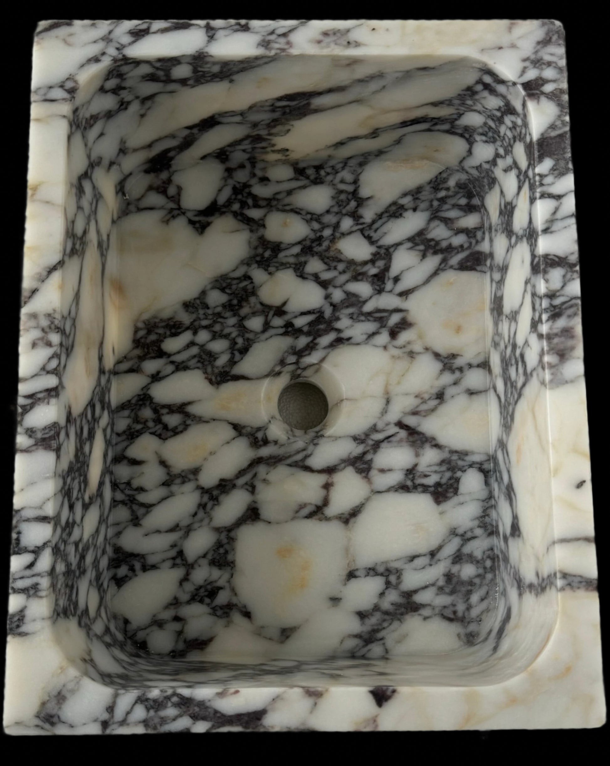 Luxury Calacatta Viola marble sink by Aurora Marble, featuring bold burgundy veining and minimalist sculptural design, handcrafted for high-end bathroom interiors.