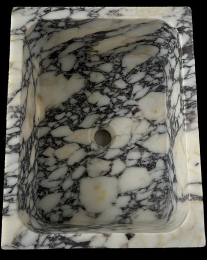 Luxury Calacatta Viola marble sink by Aurora Marble, featuring bold burgundy veining and minimalist sculptural design, handcrafted for high-end bathroom interiors.