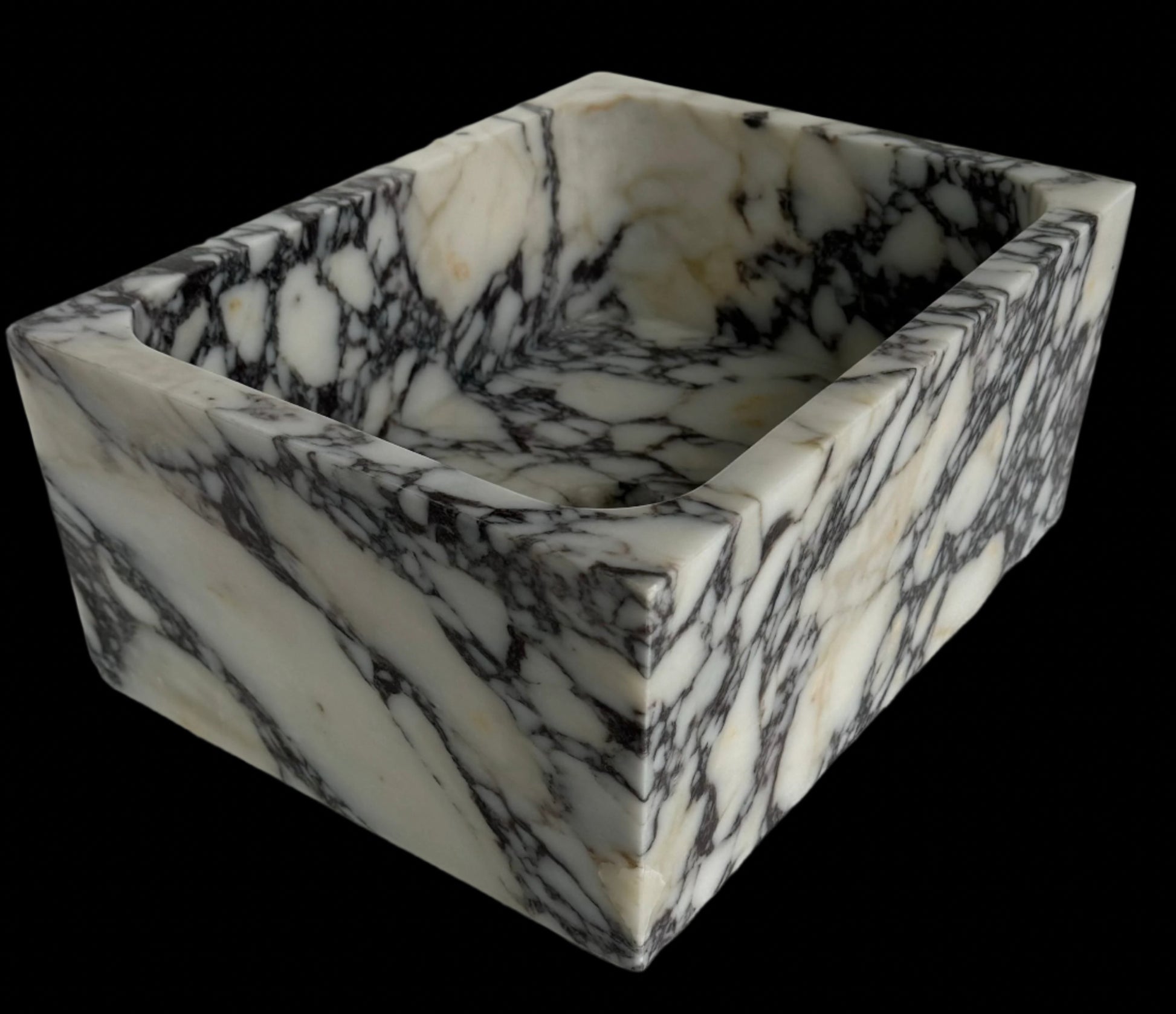 Luxury Calacatta Viola marble sink by Aurora Marble, featuring bold burgundy veining and minimalist sculptural design, handcrafted for high-end bathroom interiors.
