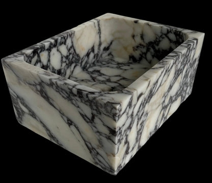 Luxury Calacatta Viola marble sink by Aurora Marble, featuring bold burgundy veining and minimalist sculptural design, handcrafted for high-end bathroom interiors.