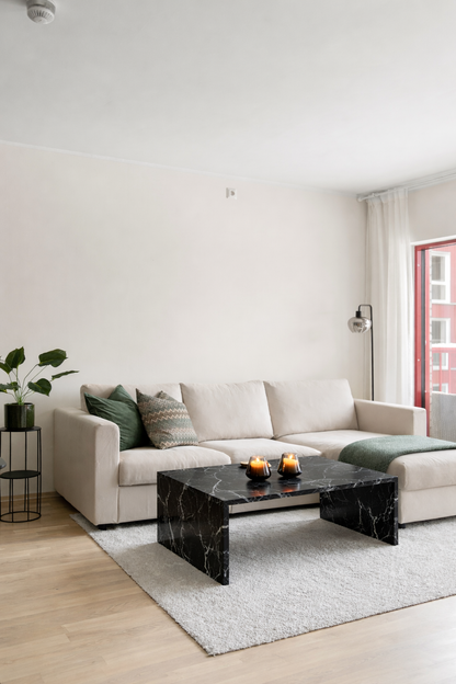 marble coffee table in a living room, made of nero marquina stone