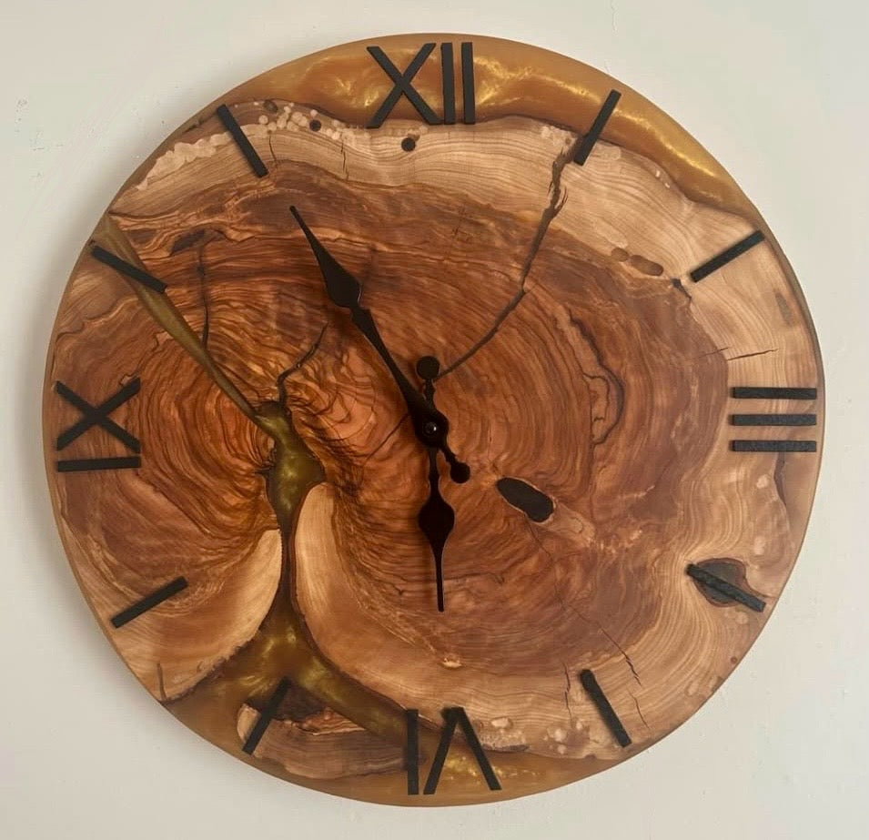 Wooden clock with natural grain pattern on a white background