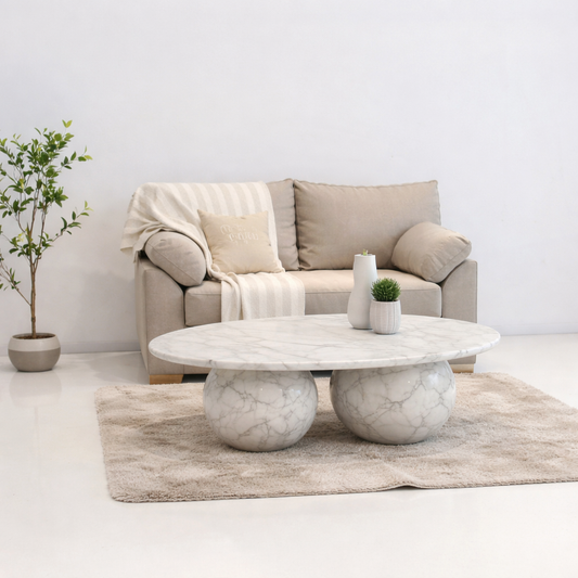 Living room with a beige sofa and marble coffee table